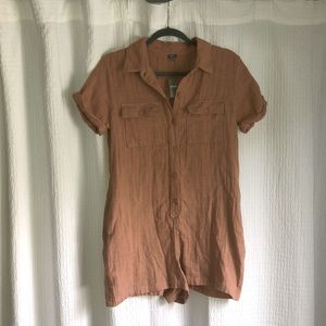 cute coral button up romper with cinched back